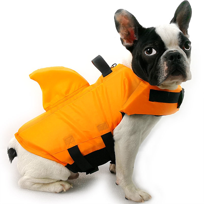 Yellow shark dog life vest with adjustable straps and rescue handle for swimming, boating, and beach adventures.