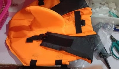 Close-up of adjustable buckle on a lightweight dog life jacket