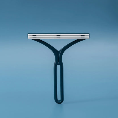 Manual pet lint brush for removing fur from fabric surfaces